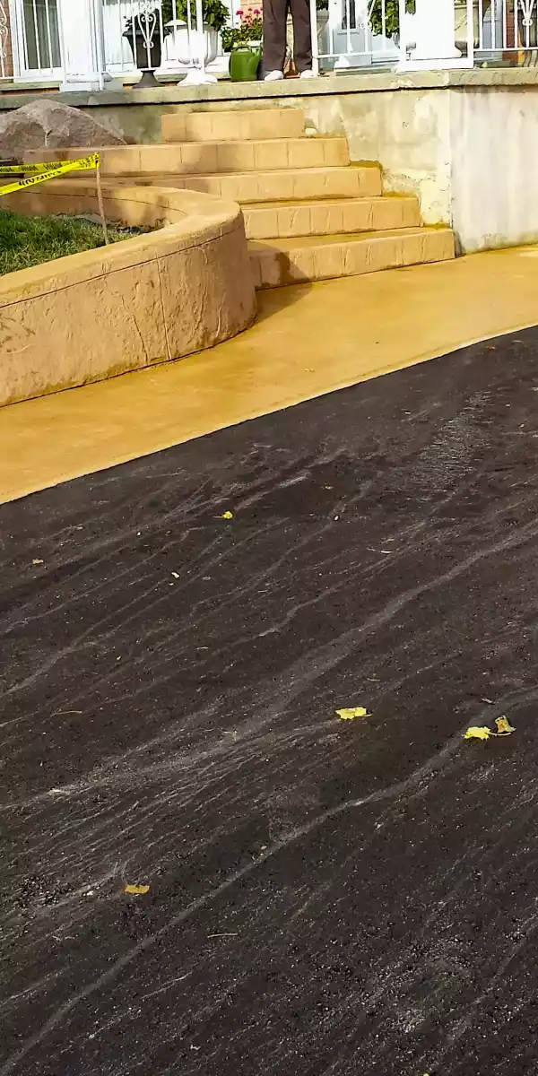 Stamped concrete retaining wall, walkway and stairs, with new aspahlt paving kitchener